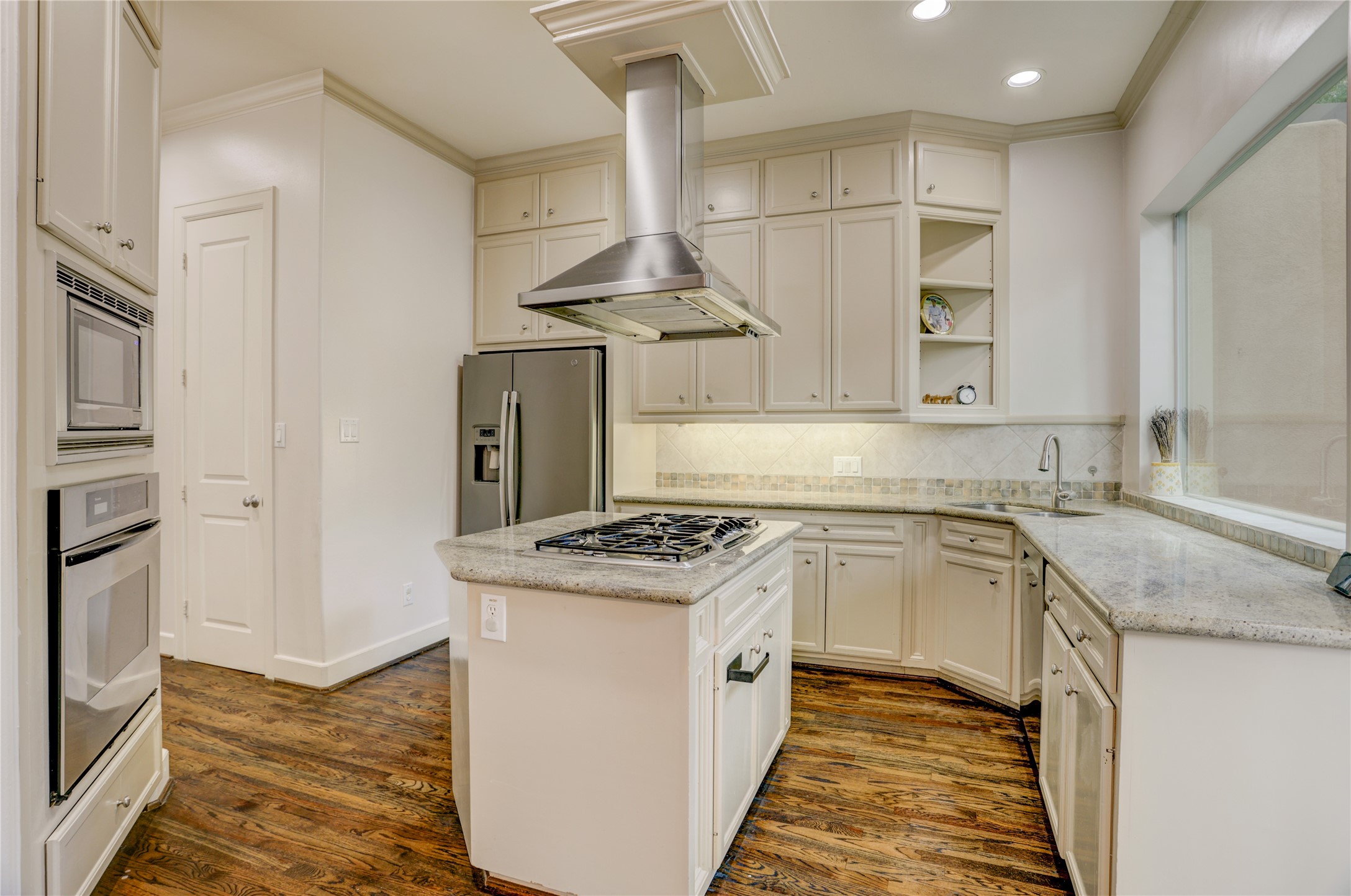 4262 Childress Street, Unit B Houston, TX 77005 - Photo 11 of 22 a kitchen with stainless steel appliances granite countertop a stove and a sink