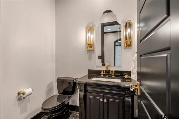 a bathroom with a sink a mirror and a shower