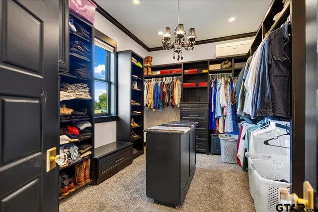 a room with ceiling fan and window