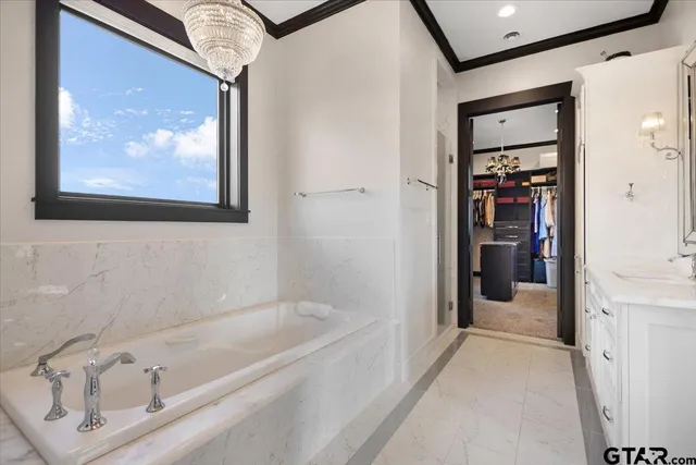 a bedroom with a bed and a desk