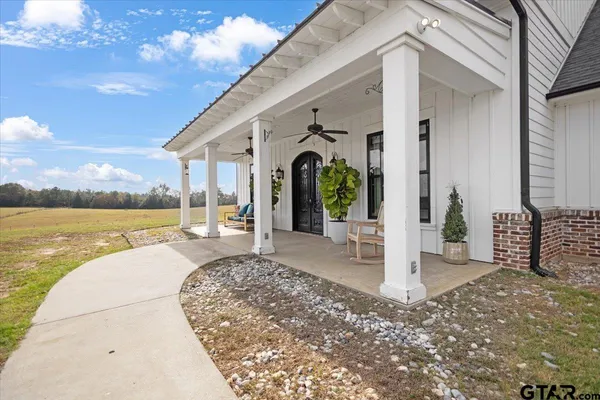 a view of a house with a potted plant