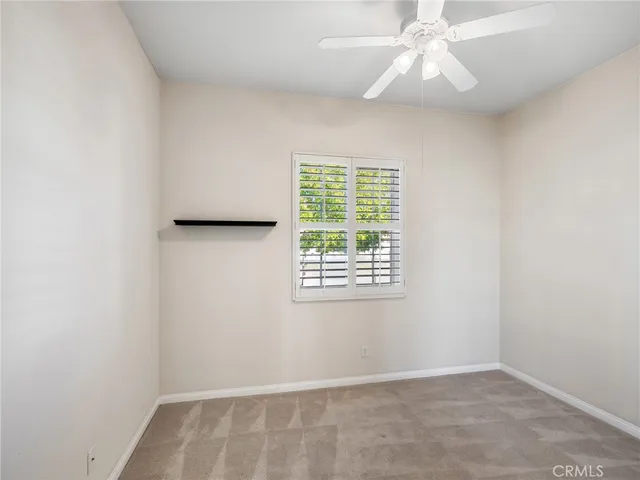 a bathroom with a granite countertop toilet a sink and shower