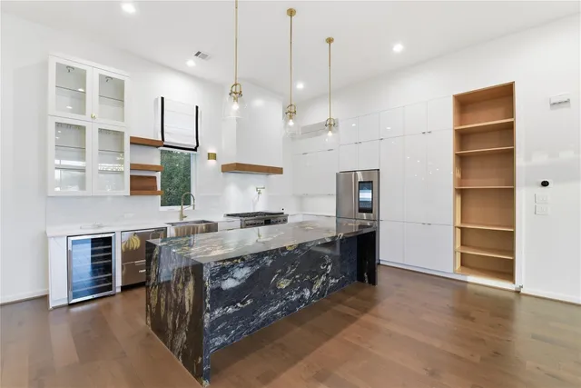 a view of a city street with tall buildings