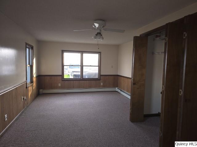 825 Augusta Road Carthage, IL 62321 - Photo 21 of 27 an empty room with windows and refrigerator