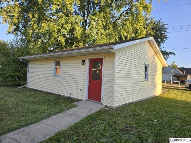 825 Augusta Road Carthage, IL 62321 - Photo 26 of 27 a backyard of a house with plants and wooden fence