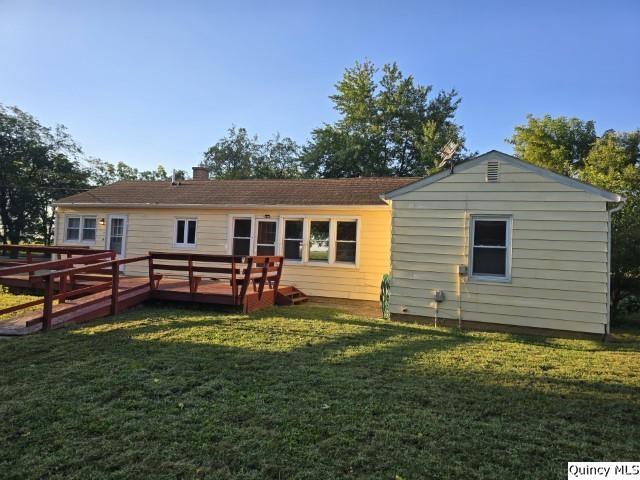 825 Augusta Road Carthage, IL 62321 - Photo 27 of 27 a backyard of a house with table and chairs