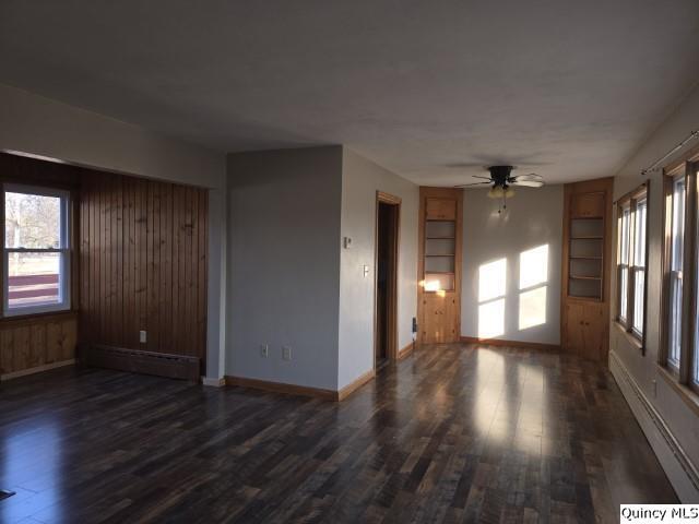 825 Augusta Road Carthage, IL 62321 - Photo 5 of 27 wooden floor in an empty room with a window