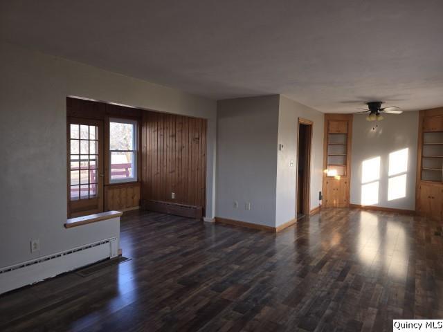825 Augusta Road Carthage, IL 62321 - Photo 6 of 27 wooden floor in an empty room with a window