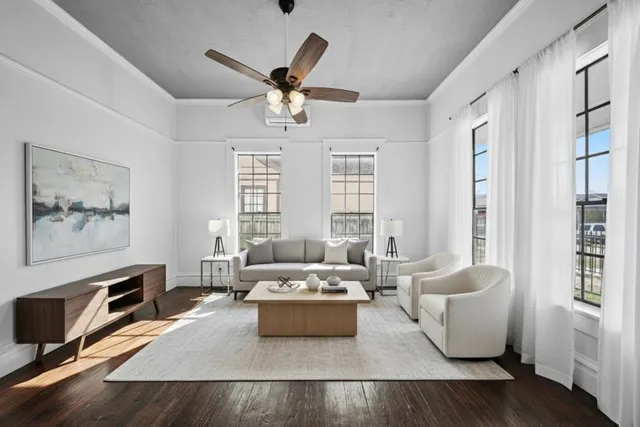 a living room with furniture and windows
