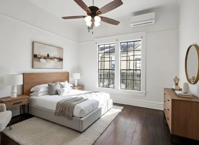 a bedroom with a large bed and a window