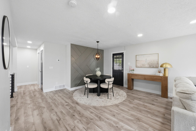 1795 South 200 West Bountiful, UT 84010 - Photo 6 of 37 Dining space featuring light wood-style flooring, a textured ceiling, and recessed lighting