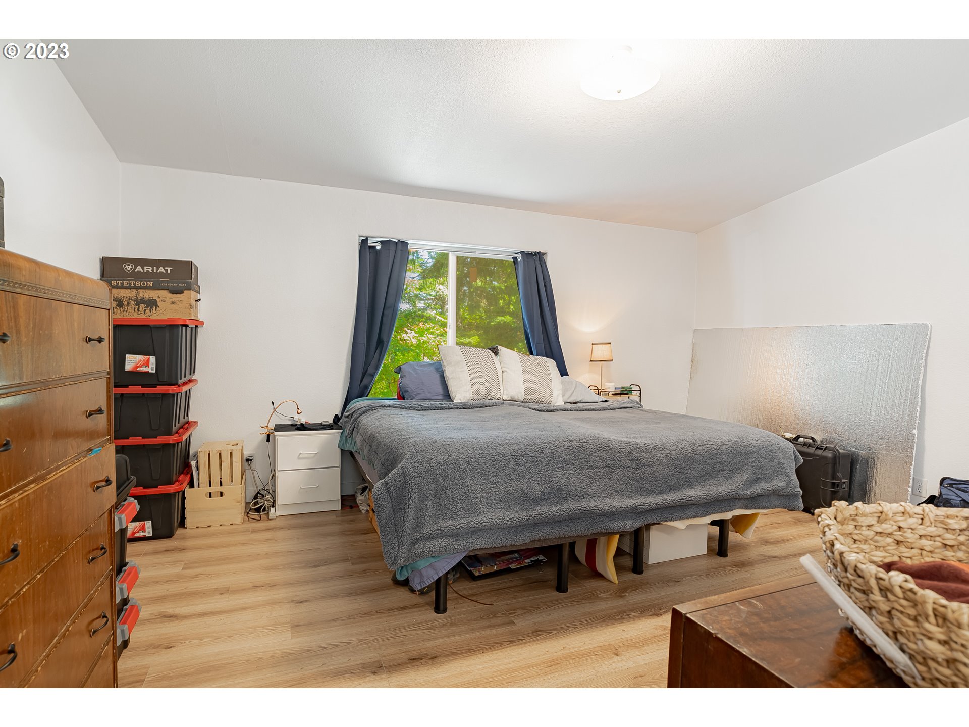 21 Nash Road White Salmon, WA 98672 - Photo 23 of 46 a bedroom with a bed and a wooden floor