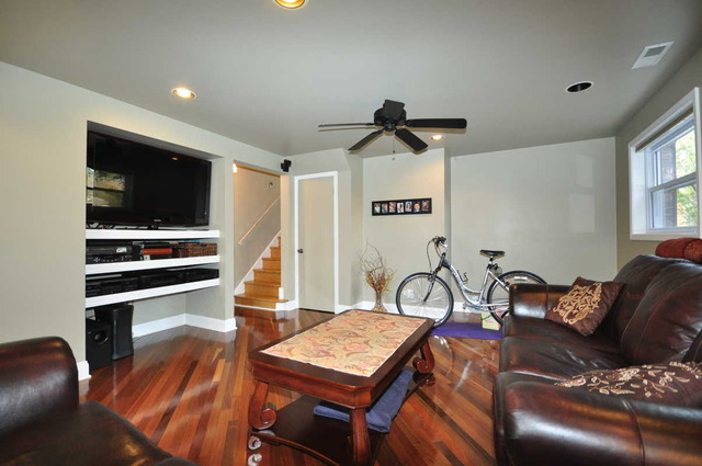 4N350 Walter Road Addison, IL 60101 - Photo 8 of 25 a living room with furniture a flat screen tv and a window