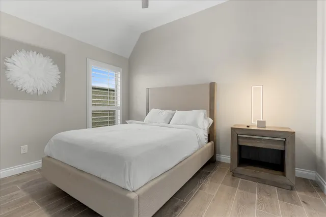 a bedroom with a bed and a fireplace