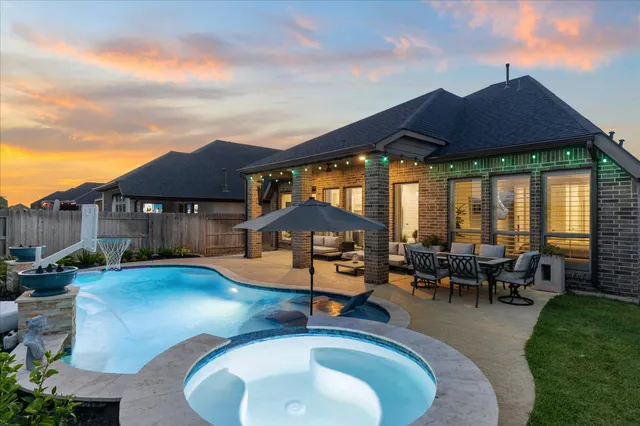 an outdoor space with furniture and umbrella