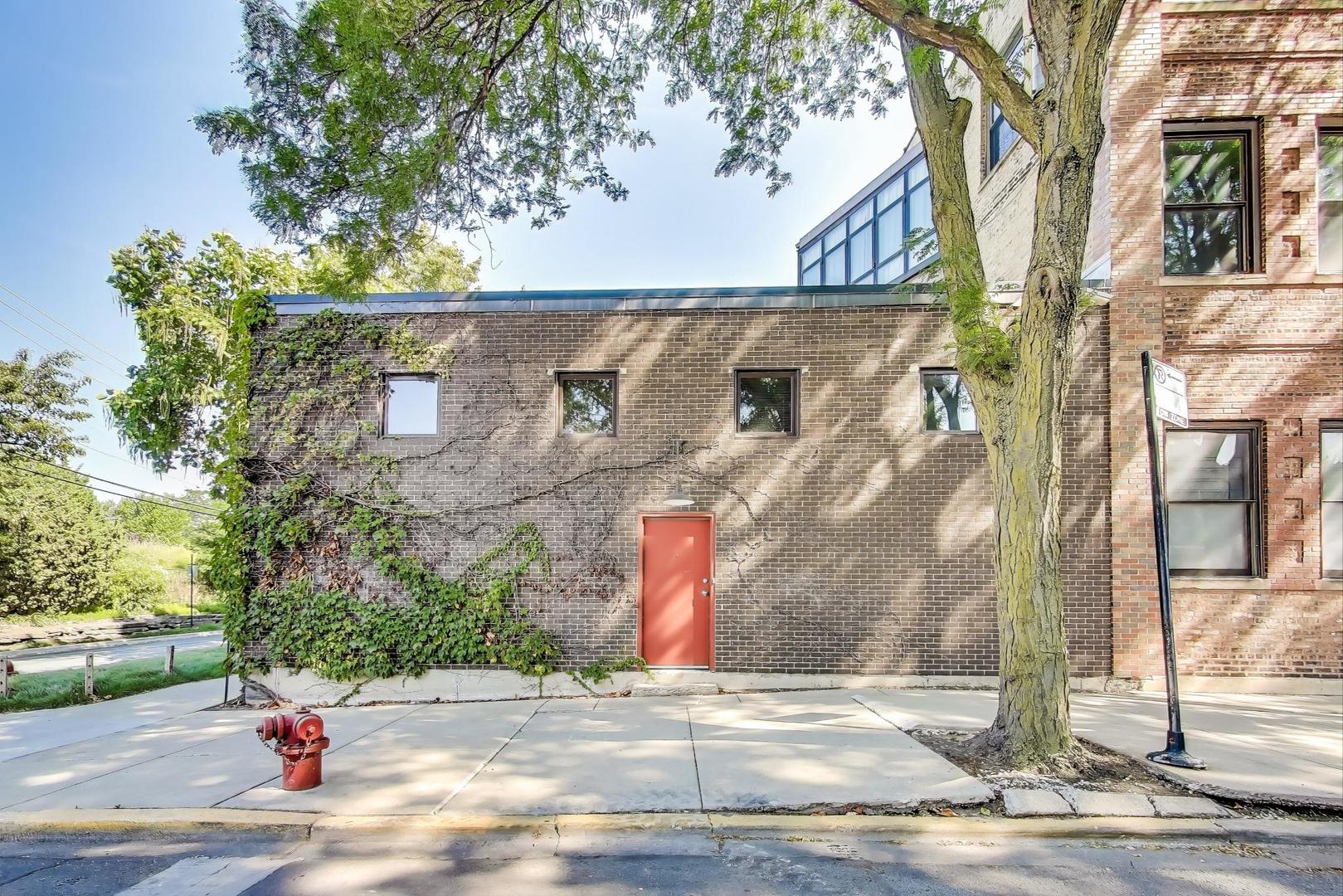 1776 West Winnemac Avenue, Unit 100 Chicago, IL 60640 - Photo 1 of 2 a view of street along with trees