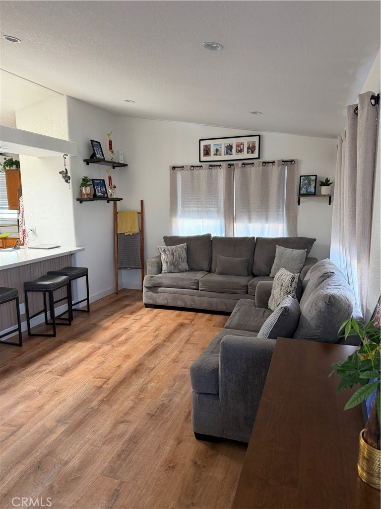 12700 Elliott, Unit 98 El Monte, CA 91732 - Photo 19 of 43 a living room with furniture and wooden floor