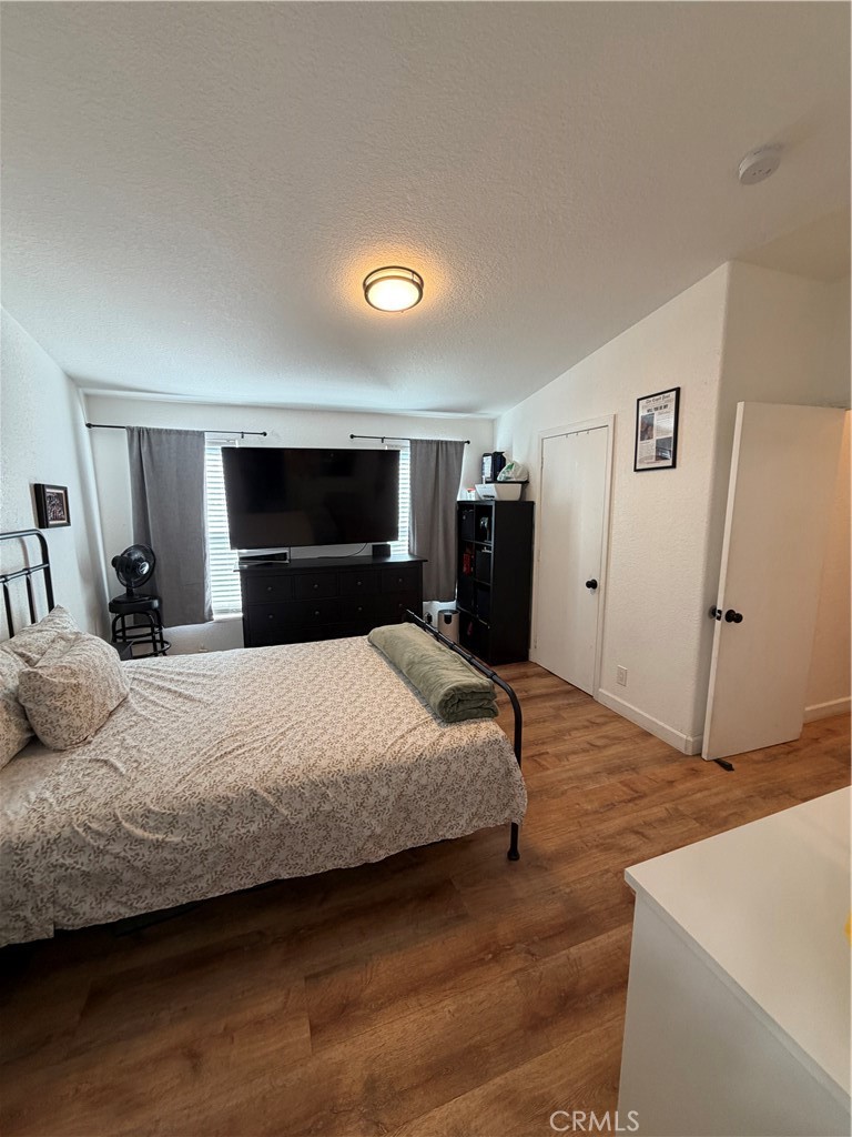12700 Elliott, Unit 98 El Monte, CA 91732 - Photo 31 of 43 a bedroom with a bed and a large mirror