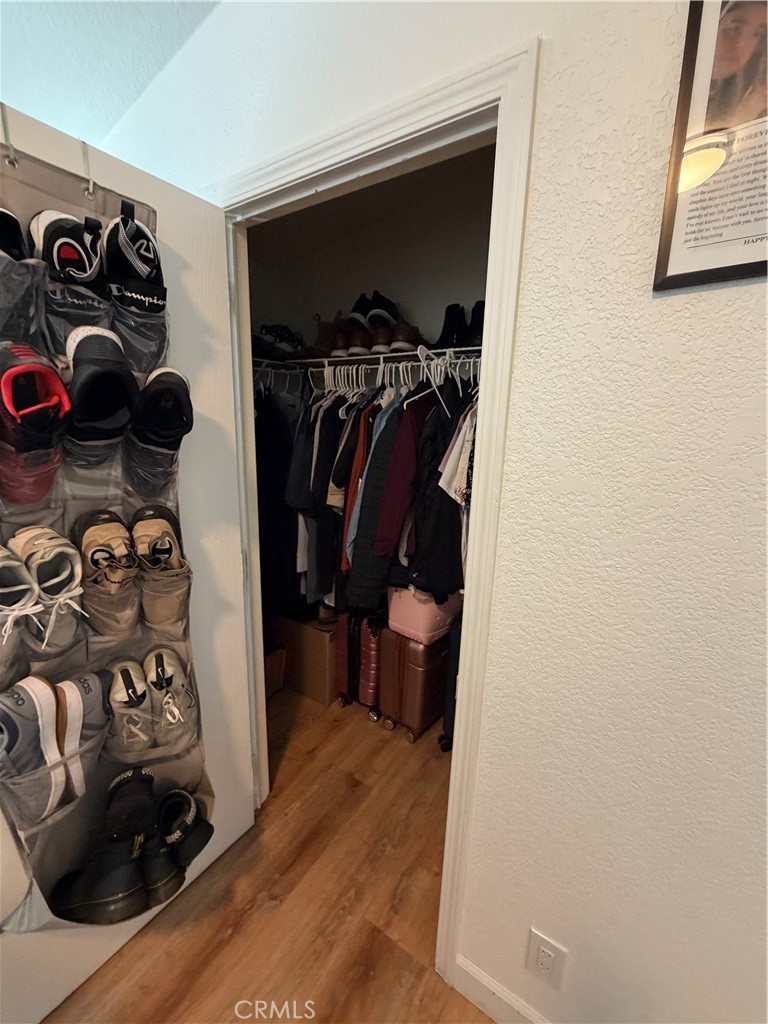 12700 Elliott, Unit 98 El Monte, CA 91732 - Photo 38 of 43 a view of walk in closet with clothes and shoes