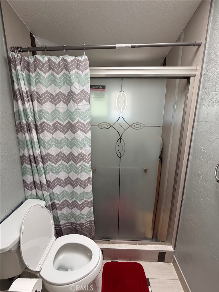 12700 Elliott, Unit 98 El Monte, CA 91732 - Photo 40 of 43 a bathroom with a toilet and shower