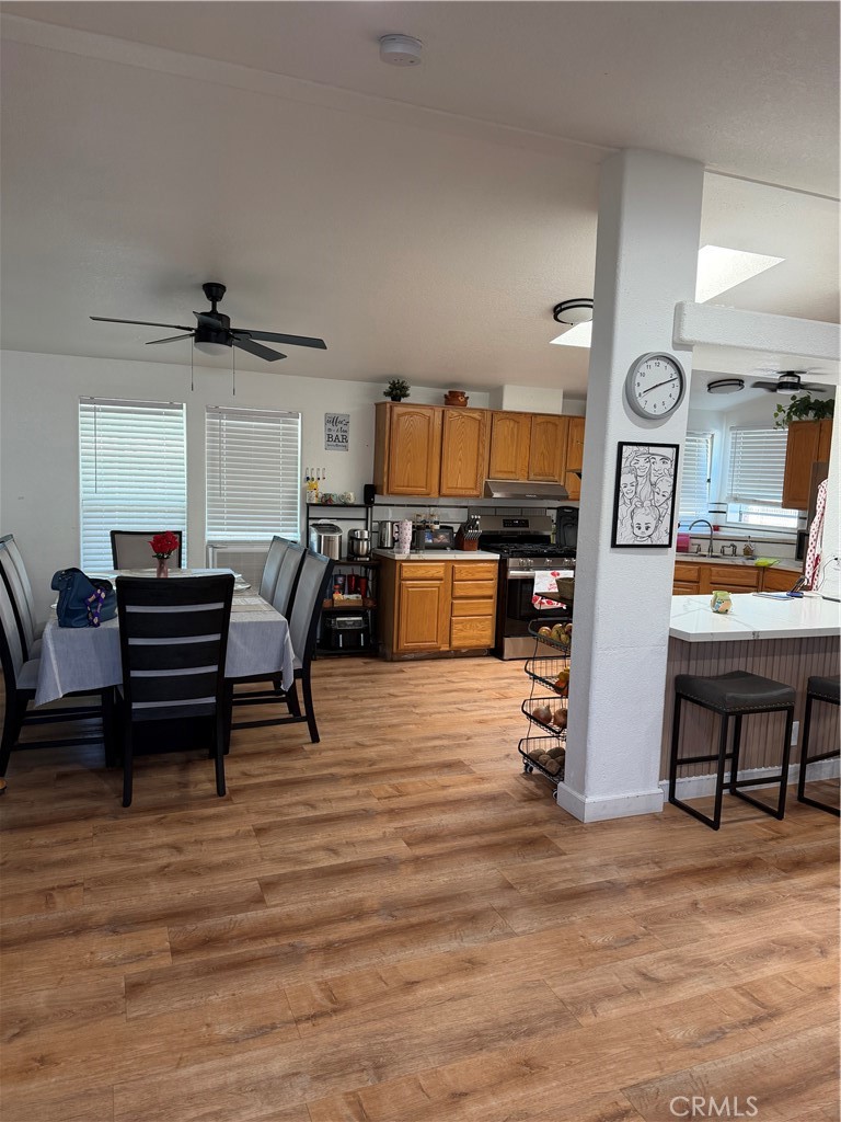 12700 Elliott, Unit 98 El Monte, CA 91732 - Photo 7 of 43 a living room with furniture and wooden floor