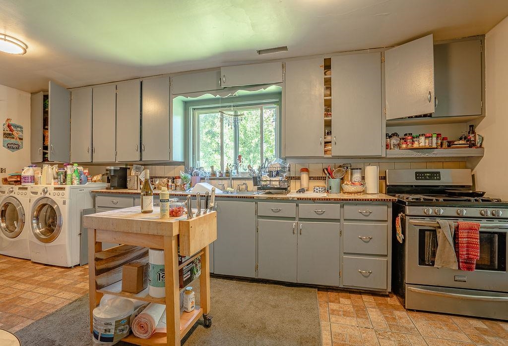 470 Riverside Avenue Chester, CA 96020 - Photo 10 of 25 a kitchen with sink a stove and cabinets