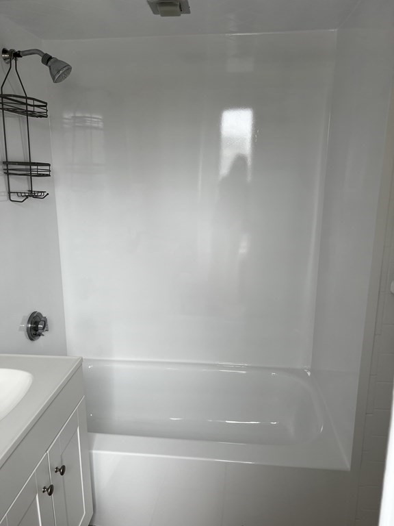 452 Main Street, Unit 1 Melrose, MA 02176 - Photo 7 of 10 a bathroom with a bathtub