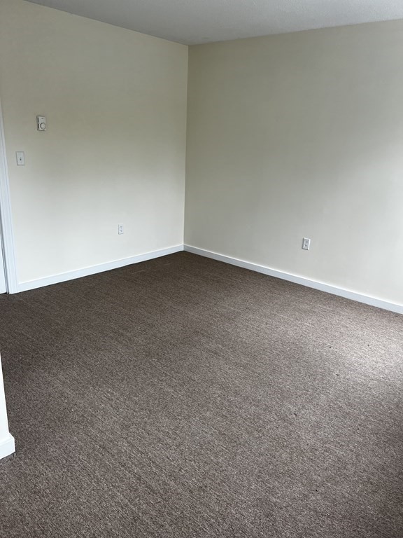 452 Main Street, Unit 1 Melrose, MA 02176 - Photo 9 of 10 a view of an empty room and has a window