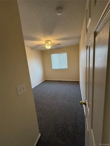 a view of empty room with windows