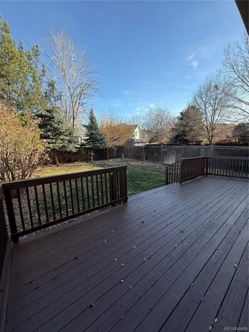a balcony with wooden floor