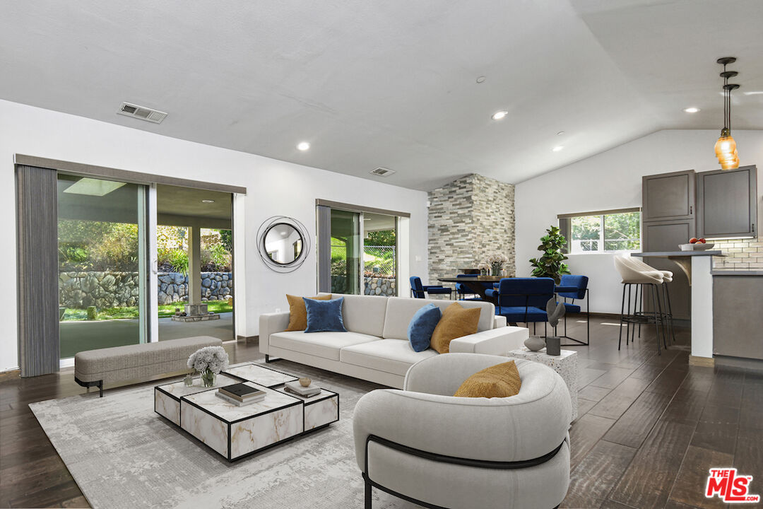 2447 Stonyvale Road Tujunga, CA 91042 - Photo 2 of 33 a living room with furniture and a large window