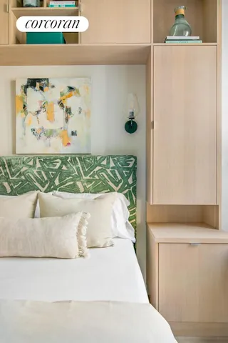 a bedroom with a large bed and a couch