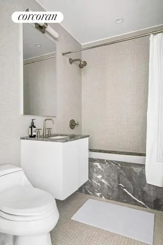 a bathroom with sink and mirror