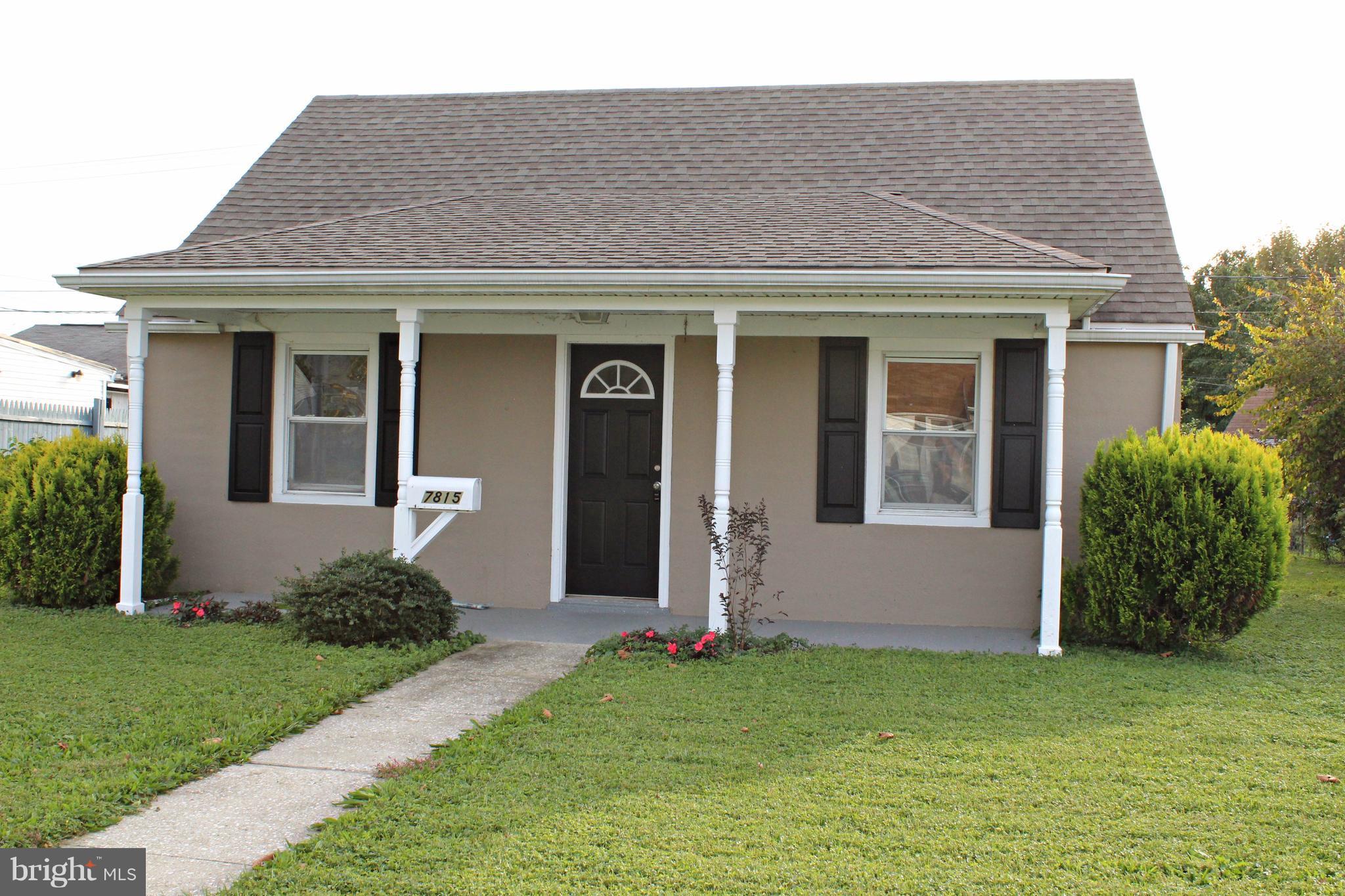 7815 Meath Road Baltimore, MD 21222 - Photo 2 of 17 a front view of a house with garden