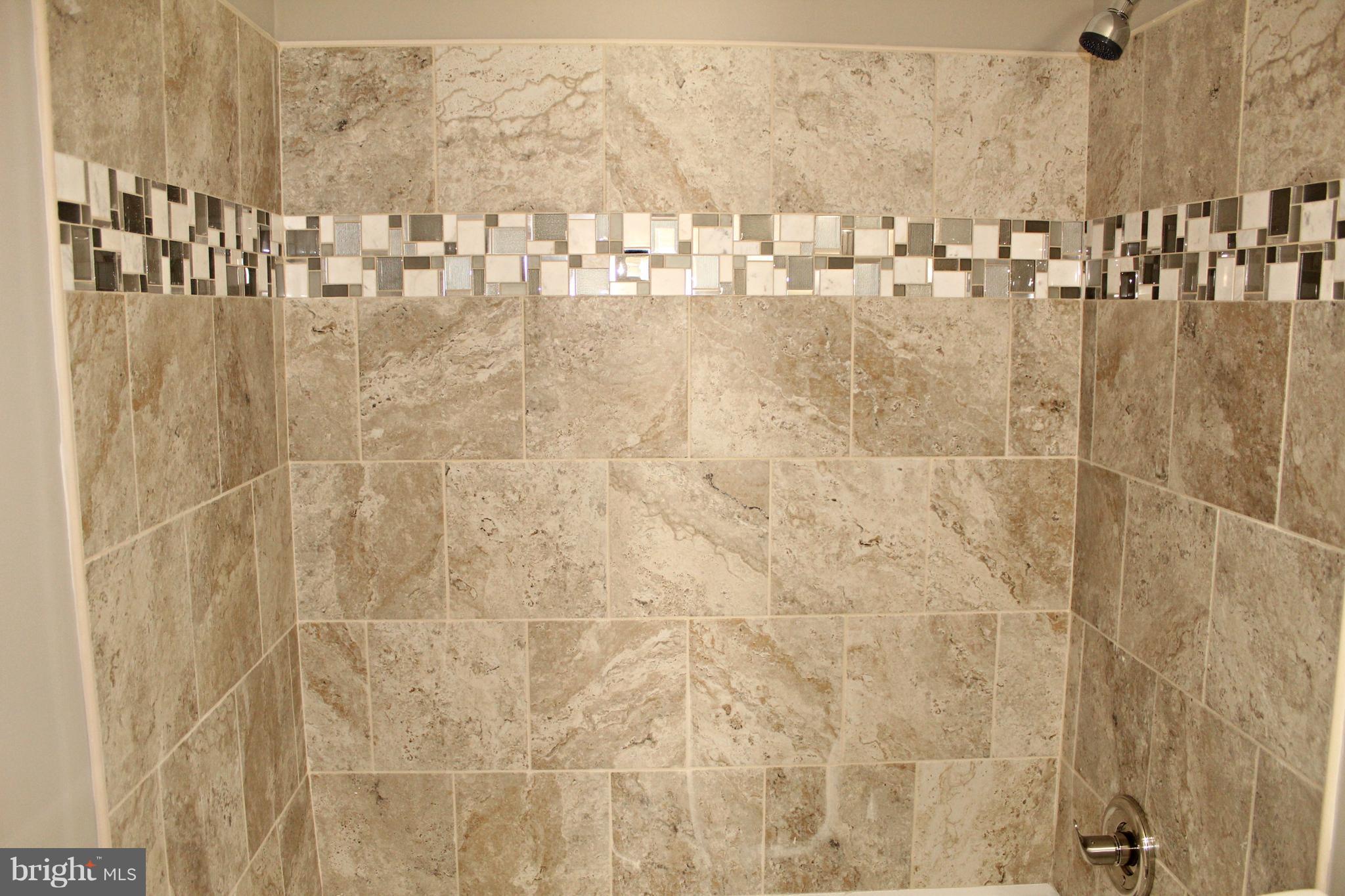 7815 Meath Road Baltimore, MD 21222 - Photo 12 of 17 a bathroom with shower