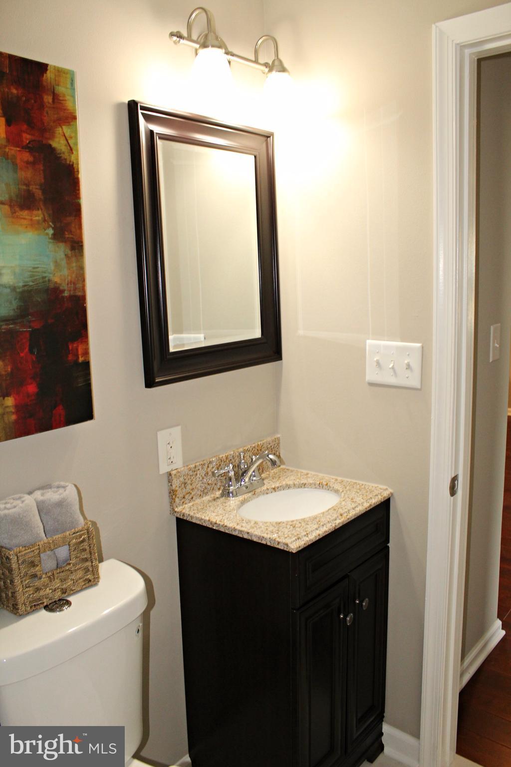 7815 Meath Road Baltimore, MD 21222 - Photo 14 of 17 a bathroom with a sink vanity and mirror
