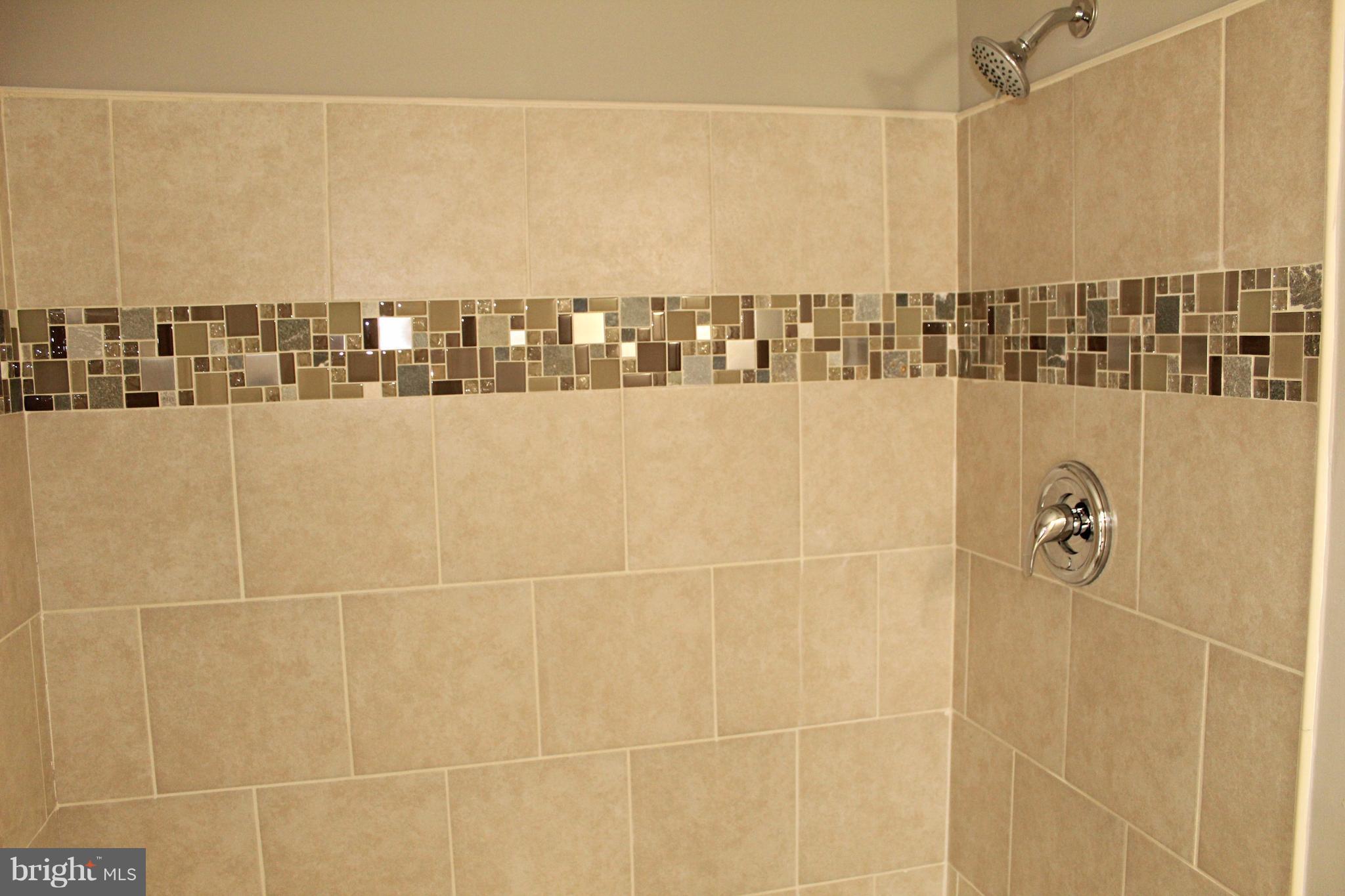 7815 Meath Road Baltimore, MD 21222 - Photo 15 of 17 a bathroom with a shower