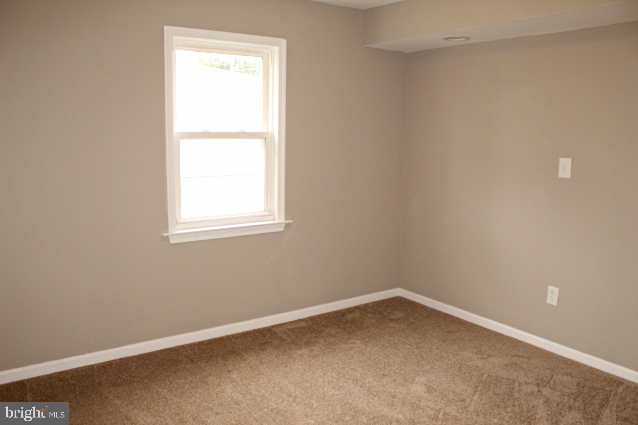 7815 Meath Road Baltimore, MD 21222 - Photo 16 of 17 an empty room with a window