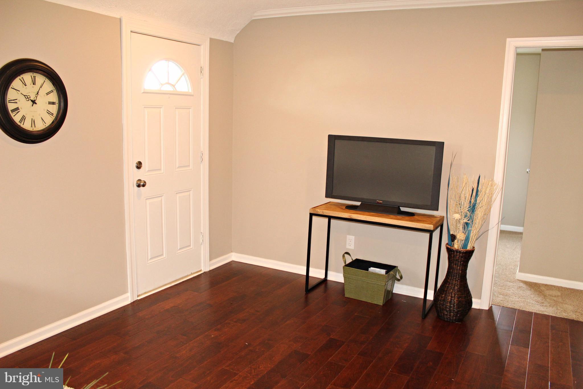 7815 Meath Road Baltimore, MD 21222 - Photo 8 of 17 a view of a workspace with wooden floor