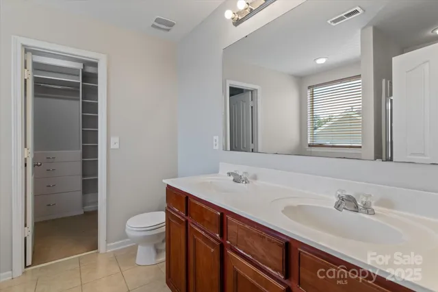 a bathroom with a tub and a window