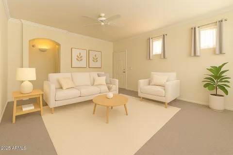 a living room with furniture and a potted plant