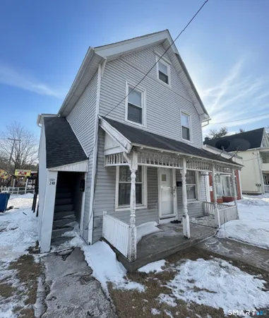 a front view of a house with a garage