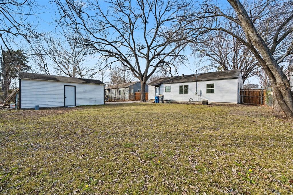 11446 Lippitt Avenue Dallas, TX 75218 - Photo 26 of 26 a house that has a tree in front of it
