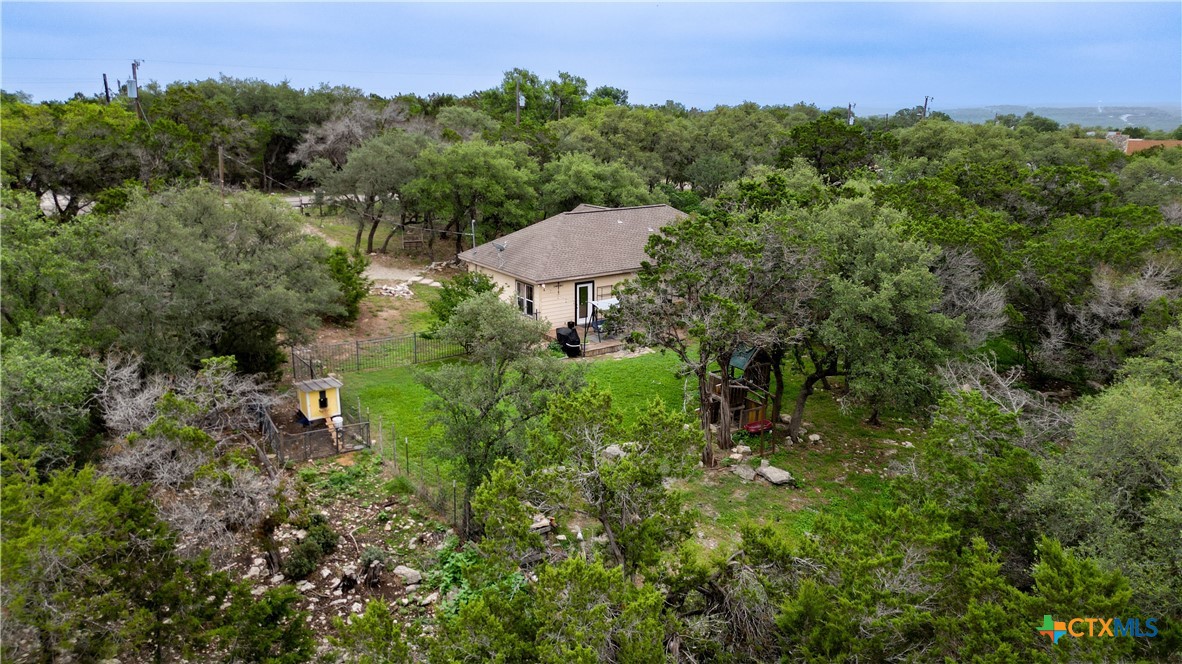 2216 Hornsby Spring Branch, TX 78070 - Photo 27 of 33 a view of a garden with a building in the background