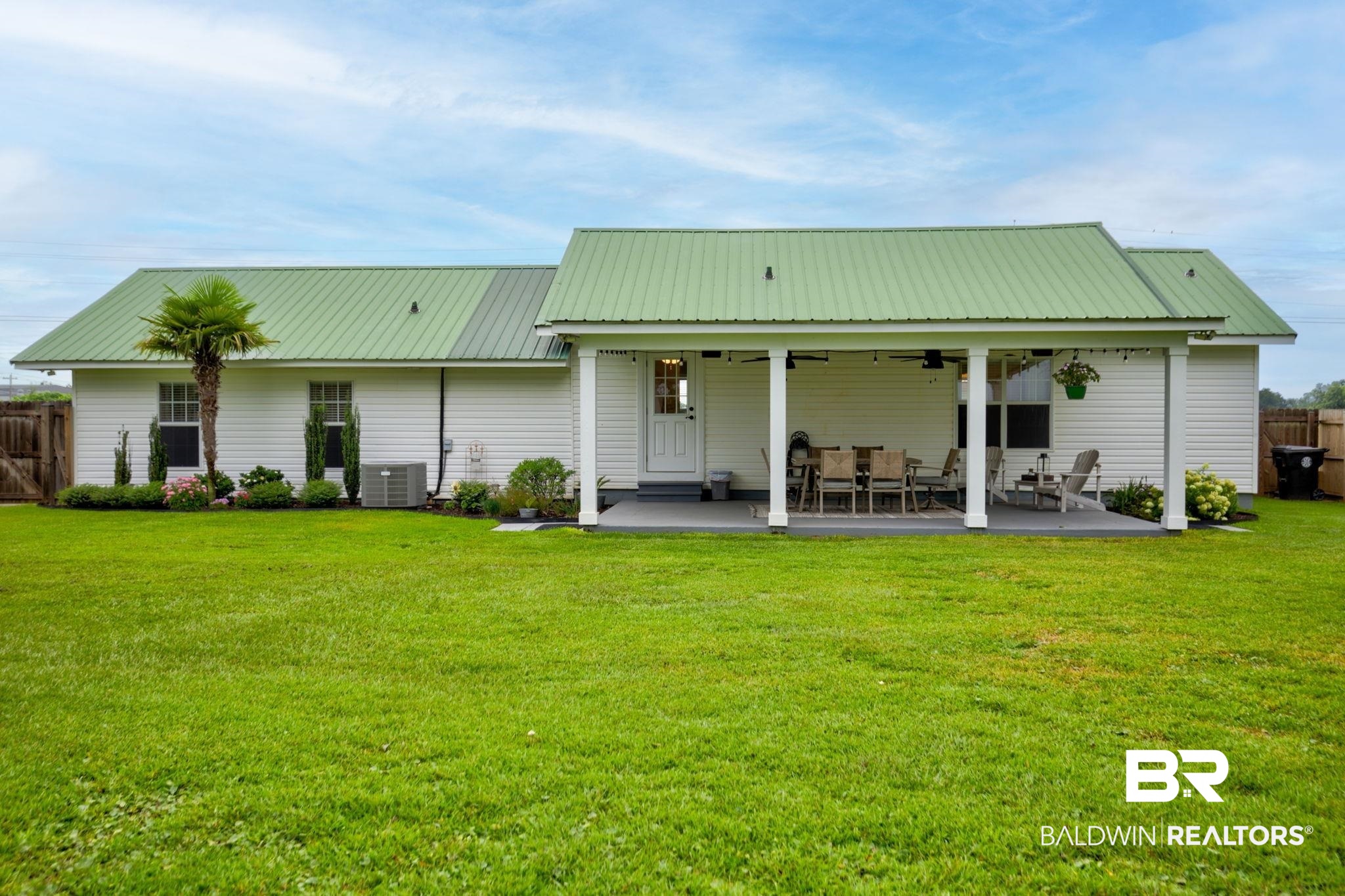 18732 Fairground Road Robertsdale, AL 36567 - Photo 33 of 46 Rear view of house with a yard, a patio area, central AC unit, and ceiling fan