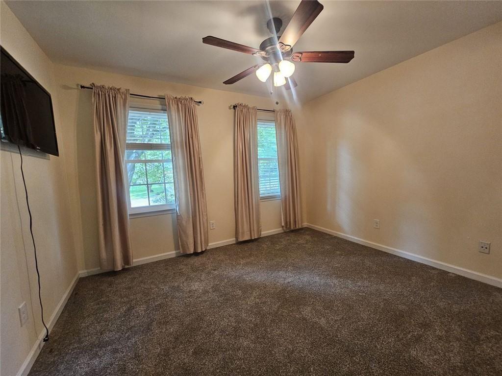 290 Oakmere Road Alpharetta, GA 30009 - Photo 16 of 26 an empty room with windows fan and windows