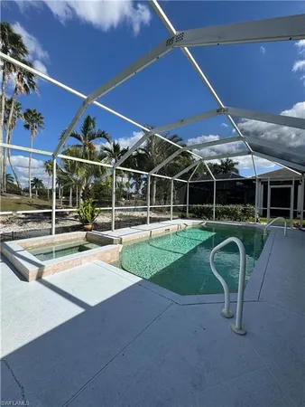 a view of a swimming pool with a patio