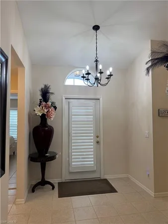 a vase of flowers sitting on a table in a room