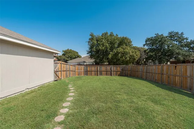 a view of backyard with green space