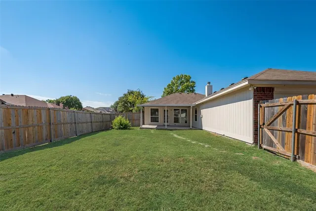 a view of a yard in front of a house with a yard